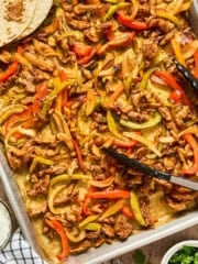 overhead view of sheet pan fajitas with tortilla.