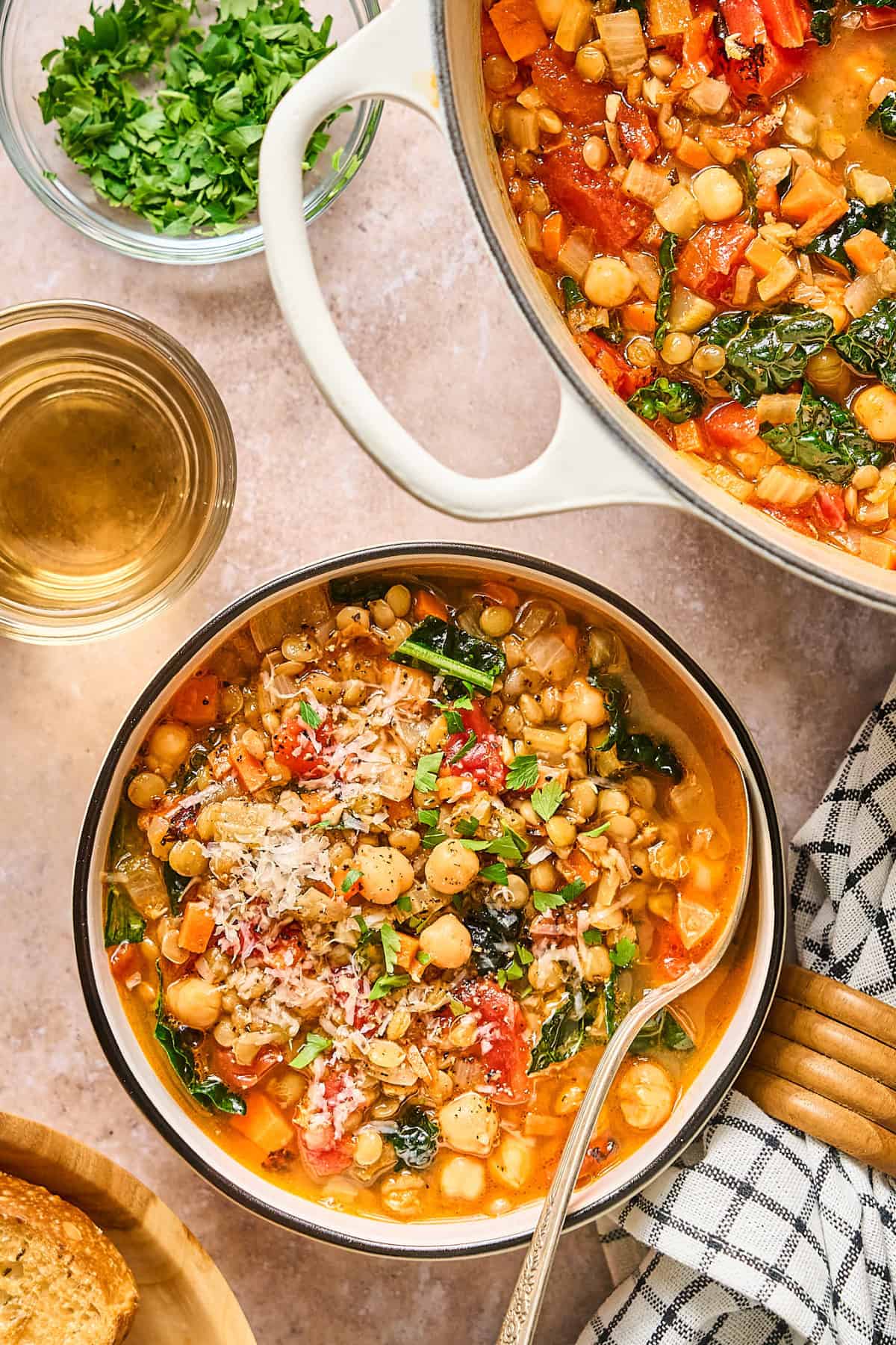 Overhead view of Italian lentil soup in a bowl and a pot.