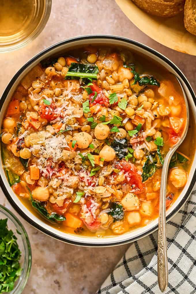 Soup in a bowl with spoon on side.