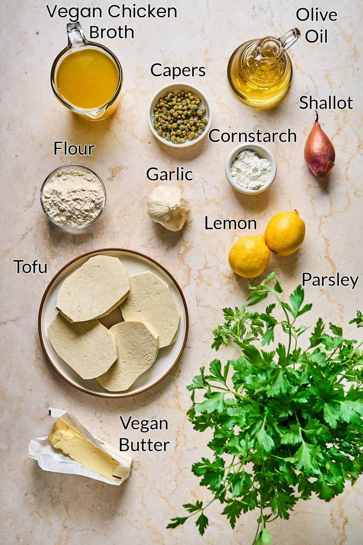 Ingredients to make the piccata recipe on a table top. 