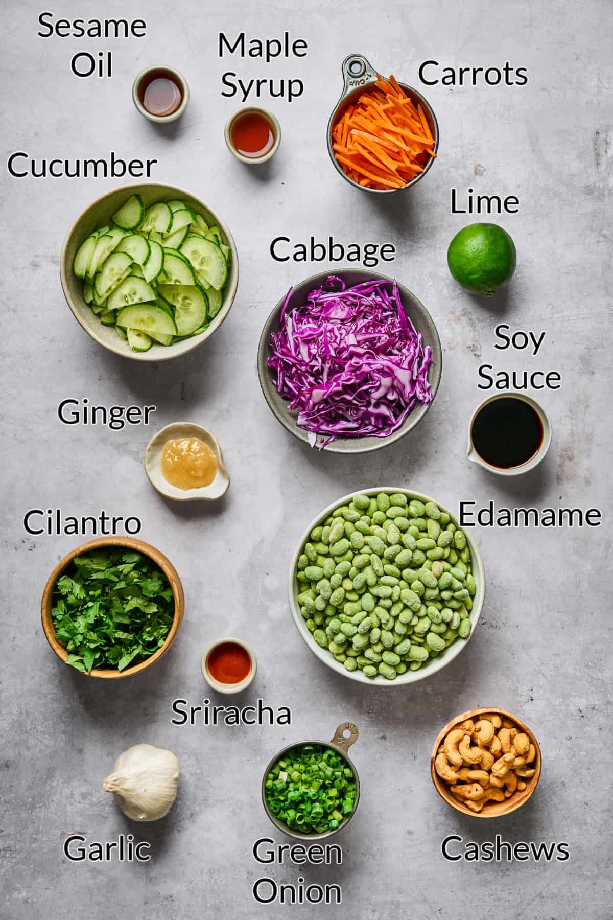Ingredients to make the recipe displayed on a stone table top.