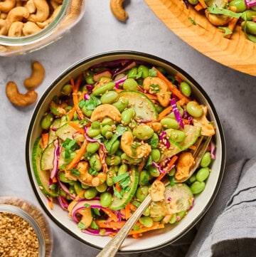 overhead view of edamame salad in a bowl with a fork on the side.