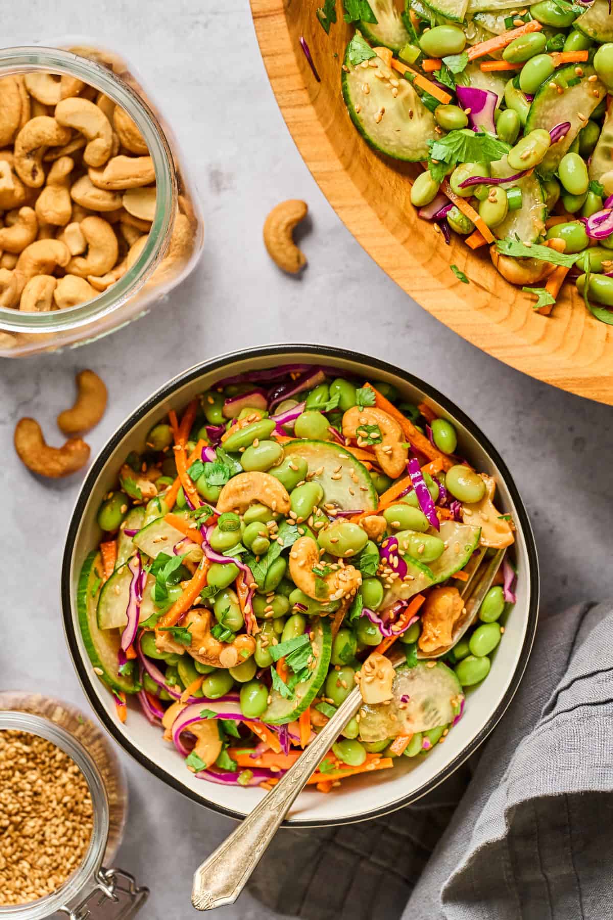 Overhead view of a bowl of edamame salad with a fork on top.
