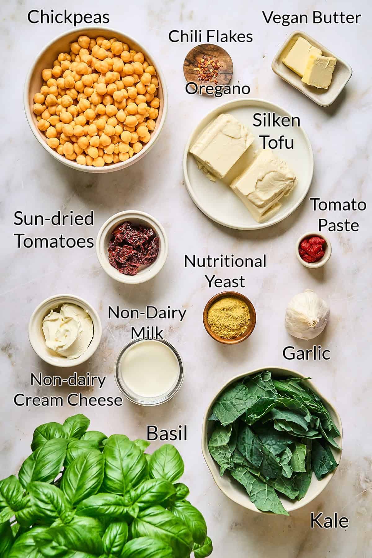 ingredients to make the garbanzo bean skillet on a marble table top. 