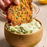 placing a fritter into dip.