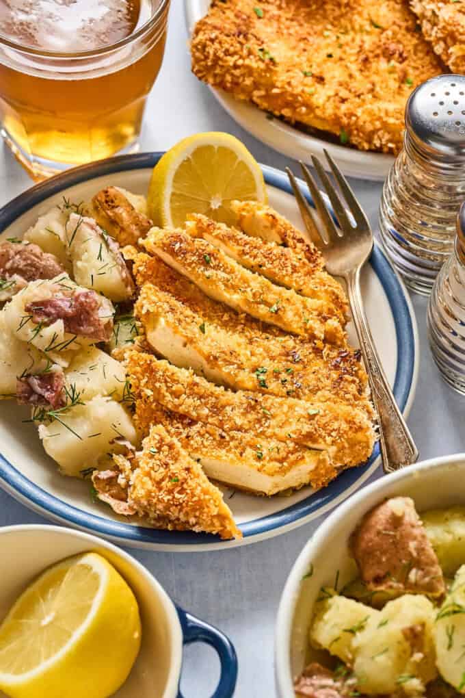 breaded tofu and potato salad on a plate.